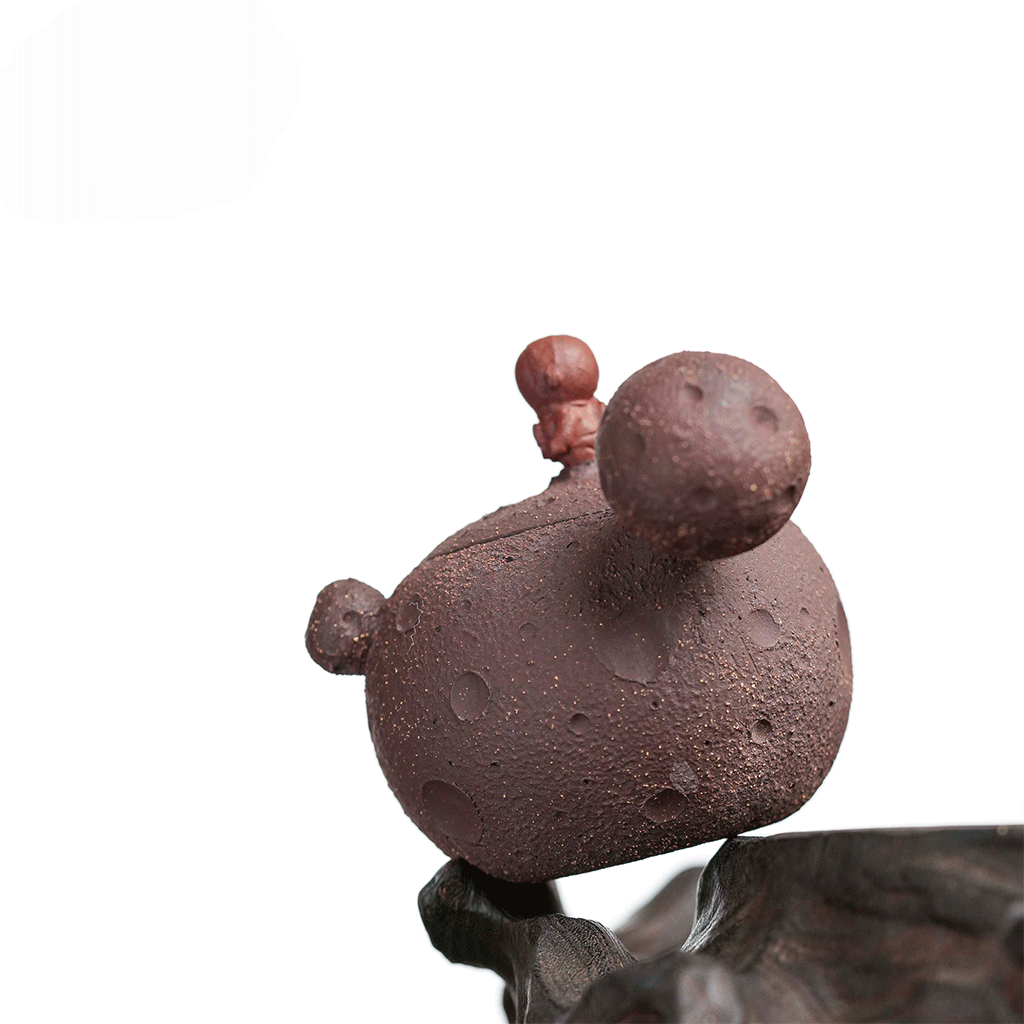 Raw purple clay teapot